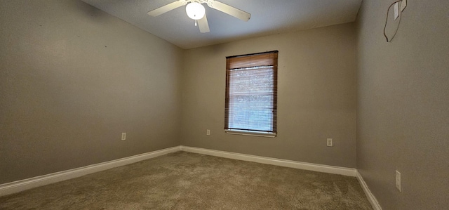 spare room with ceiling fan and carpet floors