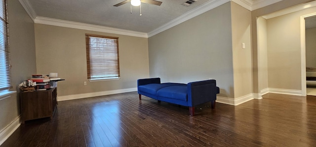 living area featuring a textured ceiling, ceiling fan, dark hardwood / wood-style flooring, and crown molding