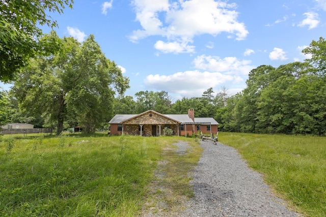 400 French Rd, Lumberton, TX 77657 - single story home with a chimney and driveway