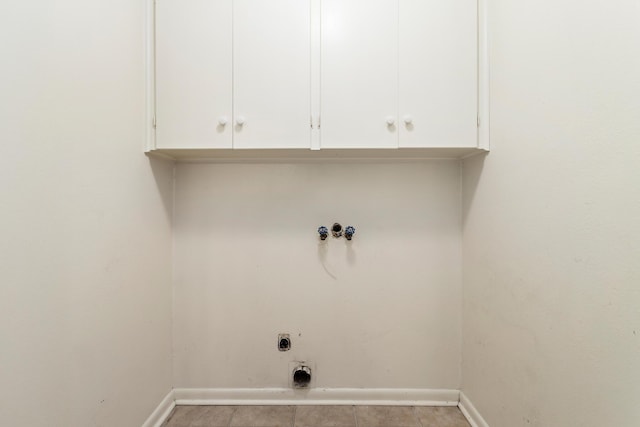 clothes washing area featuring cabinets, washer hookup, and hookup for an electric dryer