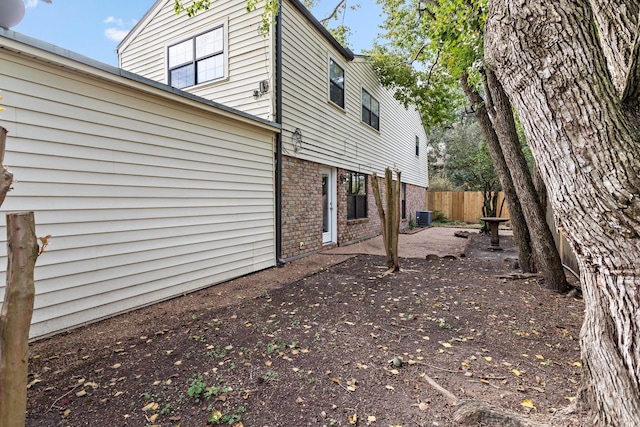 view of home's exterior featuring central air condition unit and a patio