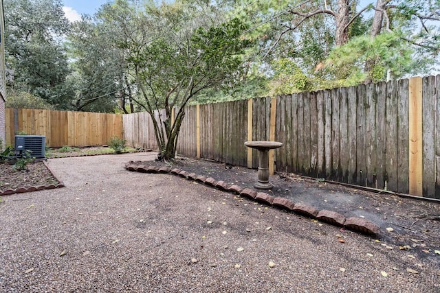 view of yard featuring central AC unit