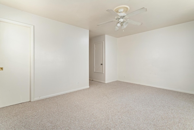 empty room with light colored carpet and ceiling fan