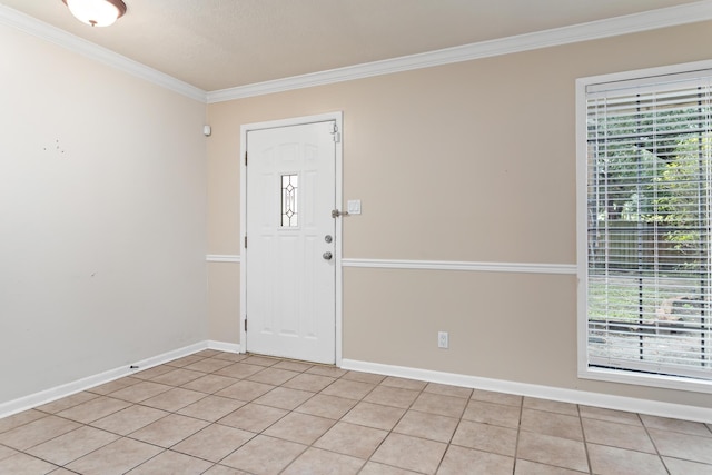 tiled entryway featuring crown molding