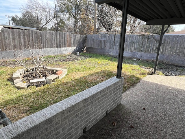 view of yard featuring a patio area and a fenced backyard