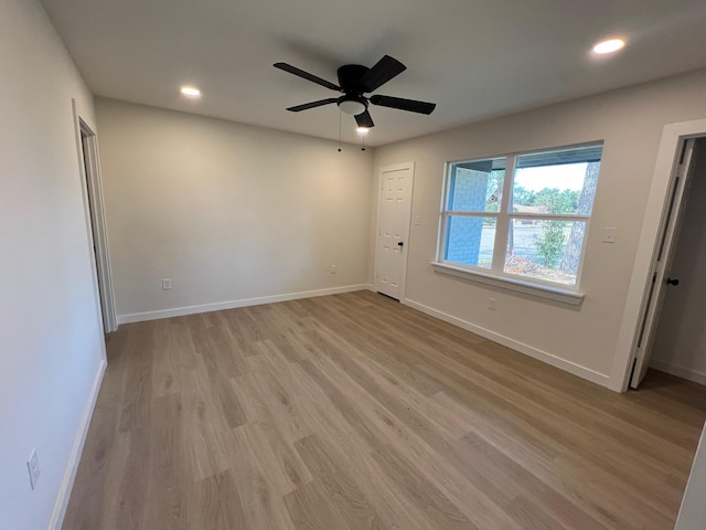 unfurnished bedroom featuring light wood-style floors, ceiling fan, baseboards, and recessed lighting