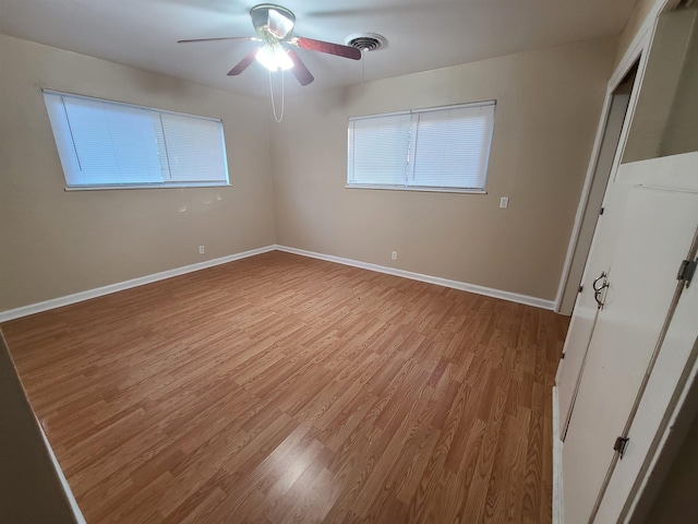 unfurnished room featuring light wood-type flooring and ceiling fan