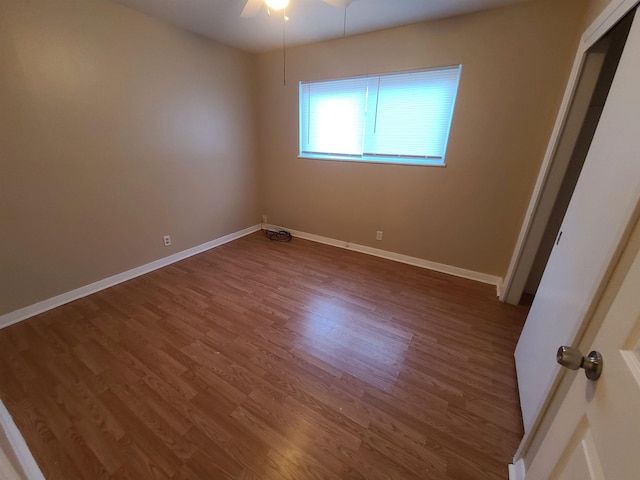 spare room featuring ceiling fan and hardwood / wood-style flooring