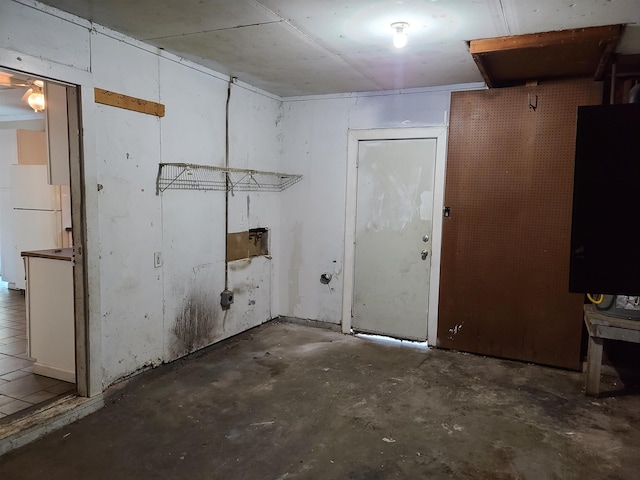 basement with white refrigerator