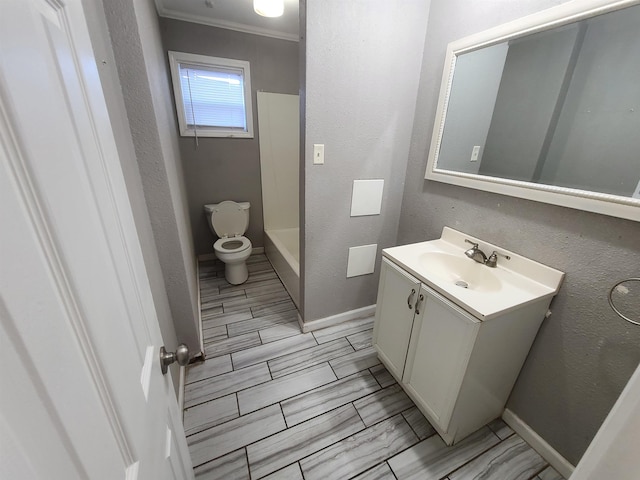 bathroom featuring vanity, toilet, walk in shower, and ornamental molding