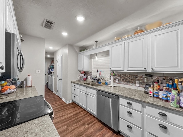 kitchen featuring dishwasher, decorative backsplash, white cabinetry, and sink