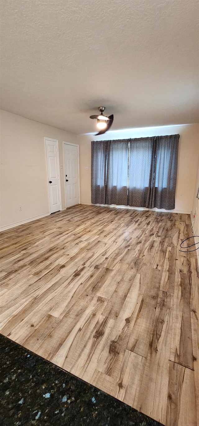 spare room with wood finished floors
