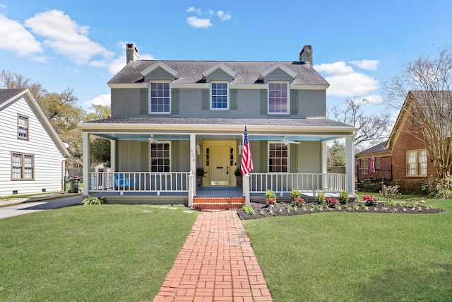 view of front of property featuring a porch, a chimney, and a front lawn