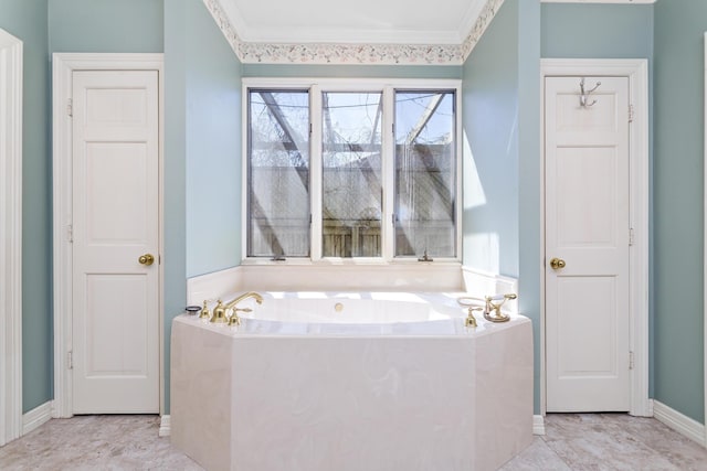 full bath featuring baseboards, a bath, and ornamental molding