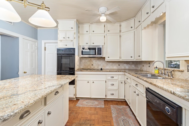 kitchen featuring light stone countertops, visible vents, a sink, decorative backsplash, and black appliances