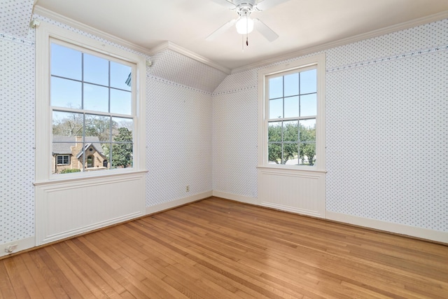 bonus room with baseboards, ceiling fan, wallpapered walls, and light wood-style floors