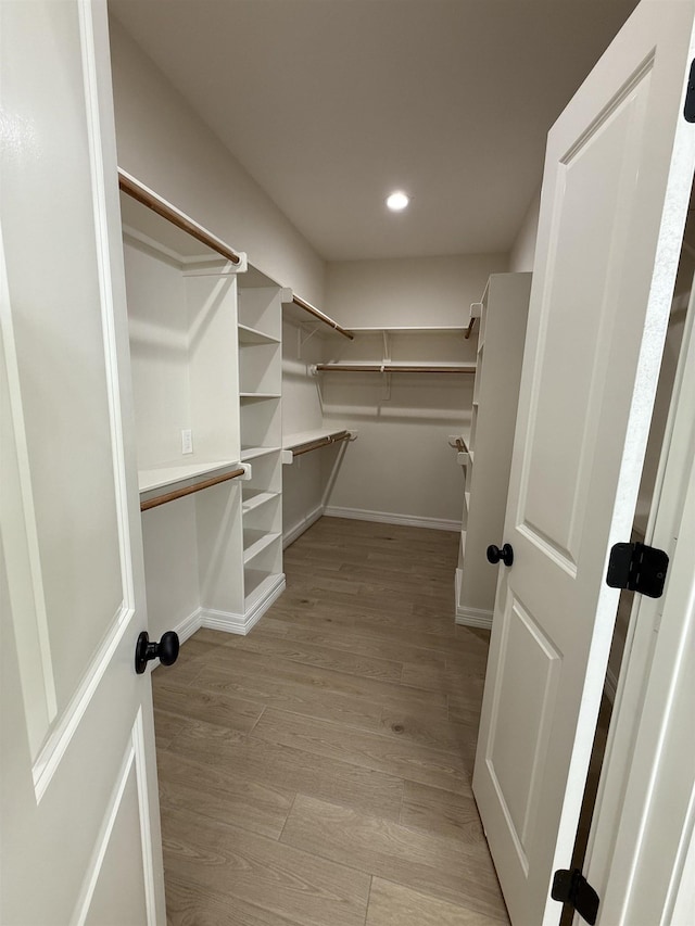 7735 Windcastle Dr, Beaumont, TX 77713 - walk in closet featuring light wood finished floors