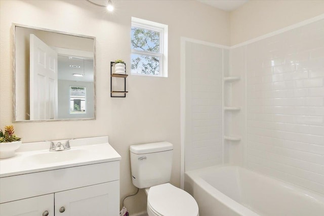 full bathroom with bathing tub / shower combination, vanity, and toilet