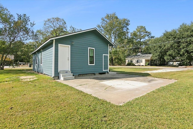 rear view of property with a yard