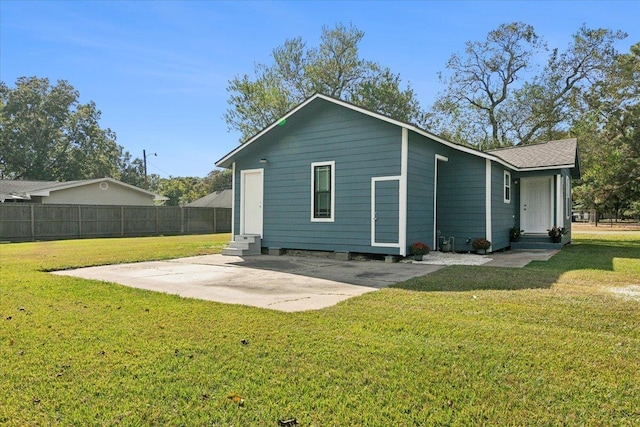 rear view of house with a lawn