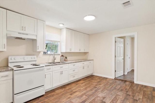 kitchen with white cabinets, light wood-type flooring, electric stove, and sink