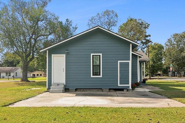 back of house with a yard