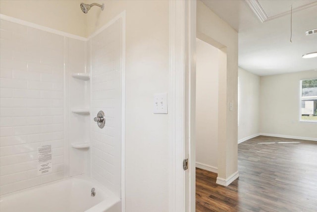 bathroom featuring hardwood / wood-style floors and shower / bath combination