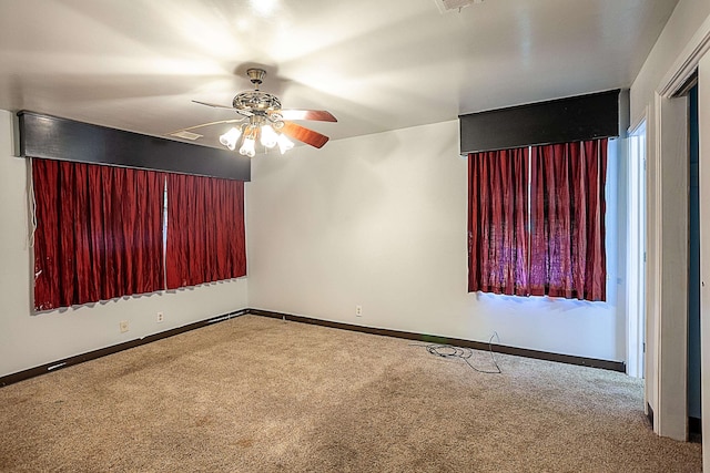 carpeted empty room with ceiling fan