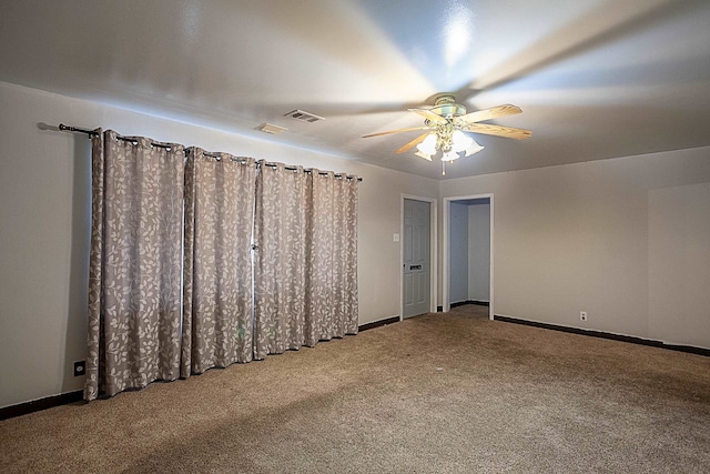 unfurnished bedroom featuring carpet floors and ceiling fan