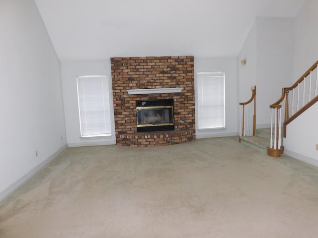 6340 Capitol St, Groves, TX 77619 - unfurnished living room with stairs, carpet floors, a fireplace, and vaulted ceiling