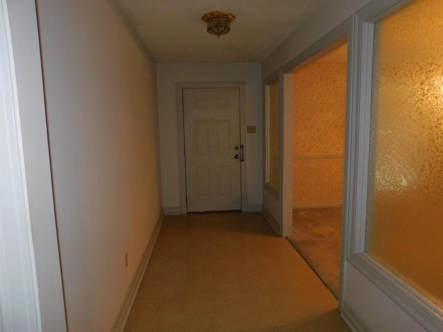 6340 Capitol St, Groves, TX 77619 - hallway with baseboards and light tile patterned floors