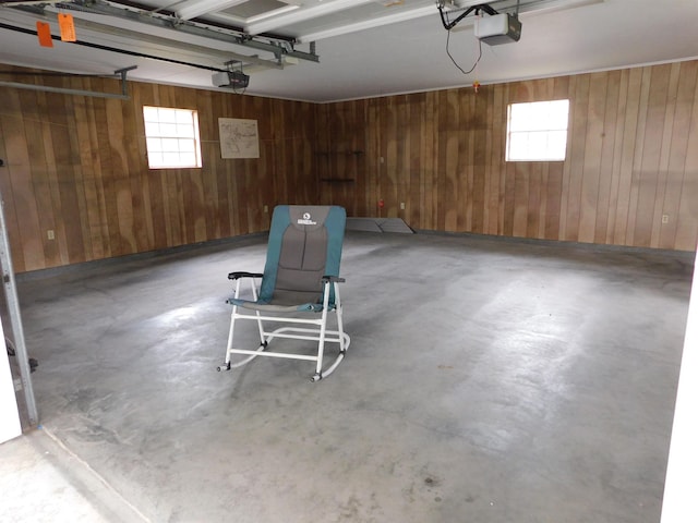 6340 Capitol St, Groves, TX 77619 - garage featuring wooden walls and a garage door opener