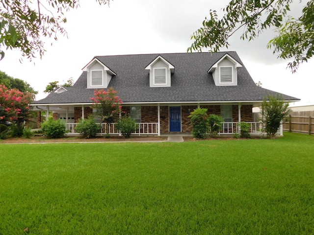 6340 Capitol St, Groves, TX 77619 - view of front facade with covered porch and a shingled roof