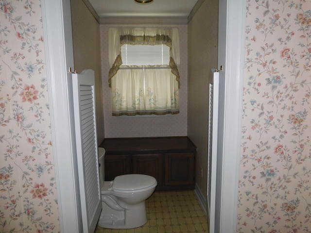 6340 Capitol St, Groves, TX 77619 - bathroom featuring wallpapered walls and tile patterned floors