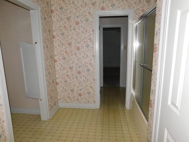 6340 Capitol St, Groves, TX 77619 - corridor with light flooring and wallpapered walls