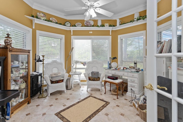 sitting room featuring a wealth of natural light, ornamental molding, and ceiling fan