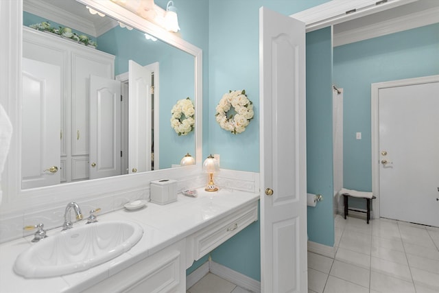 bathroom featuring tile patterned floors, vanity, and ornamental molding