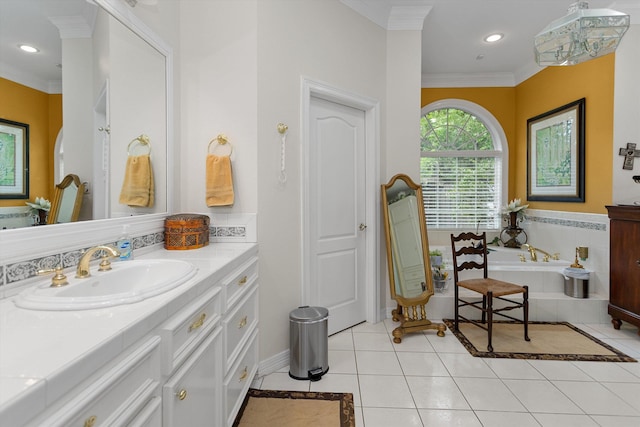 bathroom with tiled tub, crown molding, tile patterned flooring, and vanity