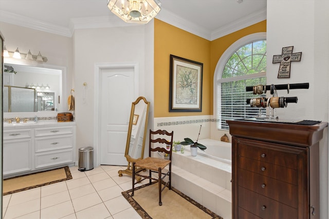 bathroom featuring tile patterned floors, vanity, crown molding, and a relaxing tiled tub