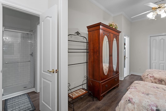 bedroom featuring connected bathroom, ceiling fan, dark hardwood / wood-style floors, and ornamental molding