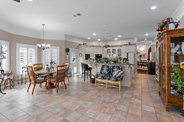 tiled dining area with crown molding and a chandelier