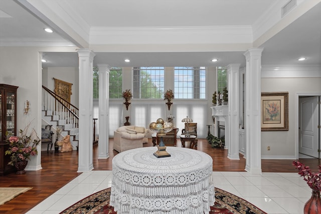 tiled entryway featuring ornamental molding