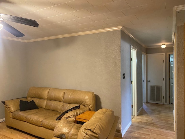  - living room with wood finished floors, ornamental molding, ceiling fan, and baseboards
