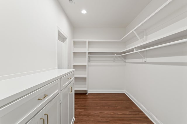 8010 Village Dr, Beaumont, TX 77713 - walk in closet with dark wood-style flooring
