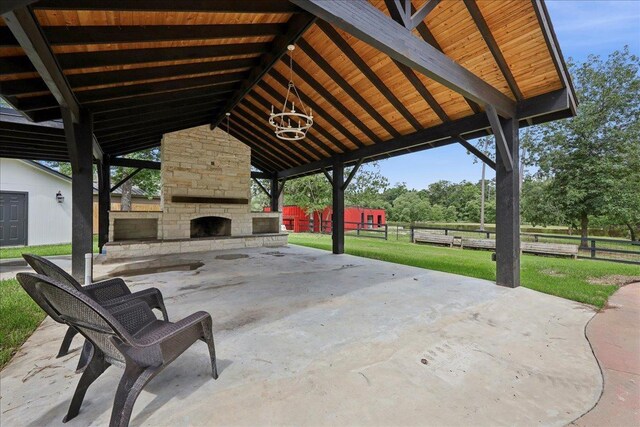 102 Timbercreek Dr, Lumberton, TX 77657 - view of patio / terrace featuring an outdoor stone fireplace