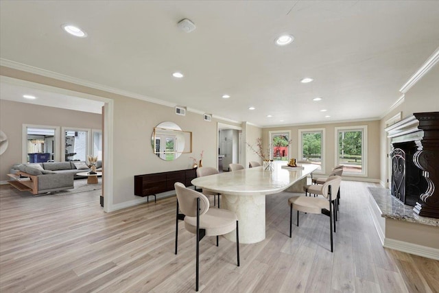 102 Timbercreek Dr, Lumberton, TX 77657 - dining space featuring ornamental molding, light wood-style floors, recessed lighting, and a high end fireplace