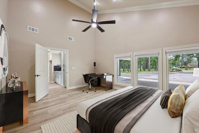 102 Timbercreek Dr, Lumberton, TX 77657 - bedroom featuring an office area, a high ceiling, ornamental molding, light wood-type flooring, and access to outside