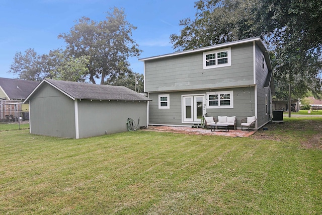 rear view of property featuring cooling unit, a lawn, an outdoor living space, and a patio