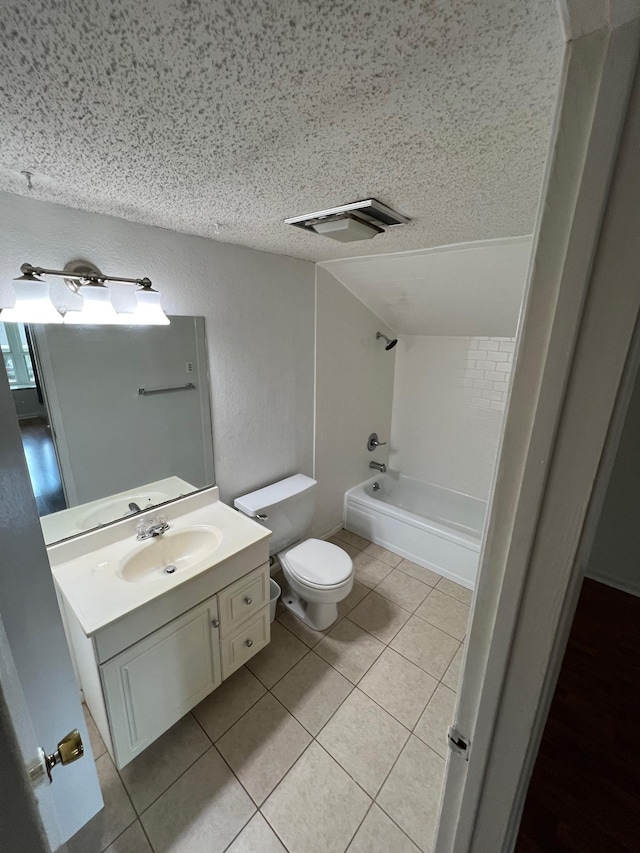 full bath with vanity, toilet, bathtub / shower combination, vaulted ceiling, and a textured ceiling