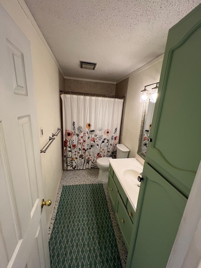 bathroom with toilet, curtained shower, vanity, visible vents, and a textured ceiling